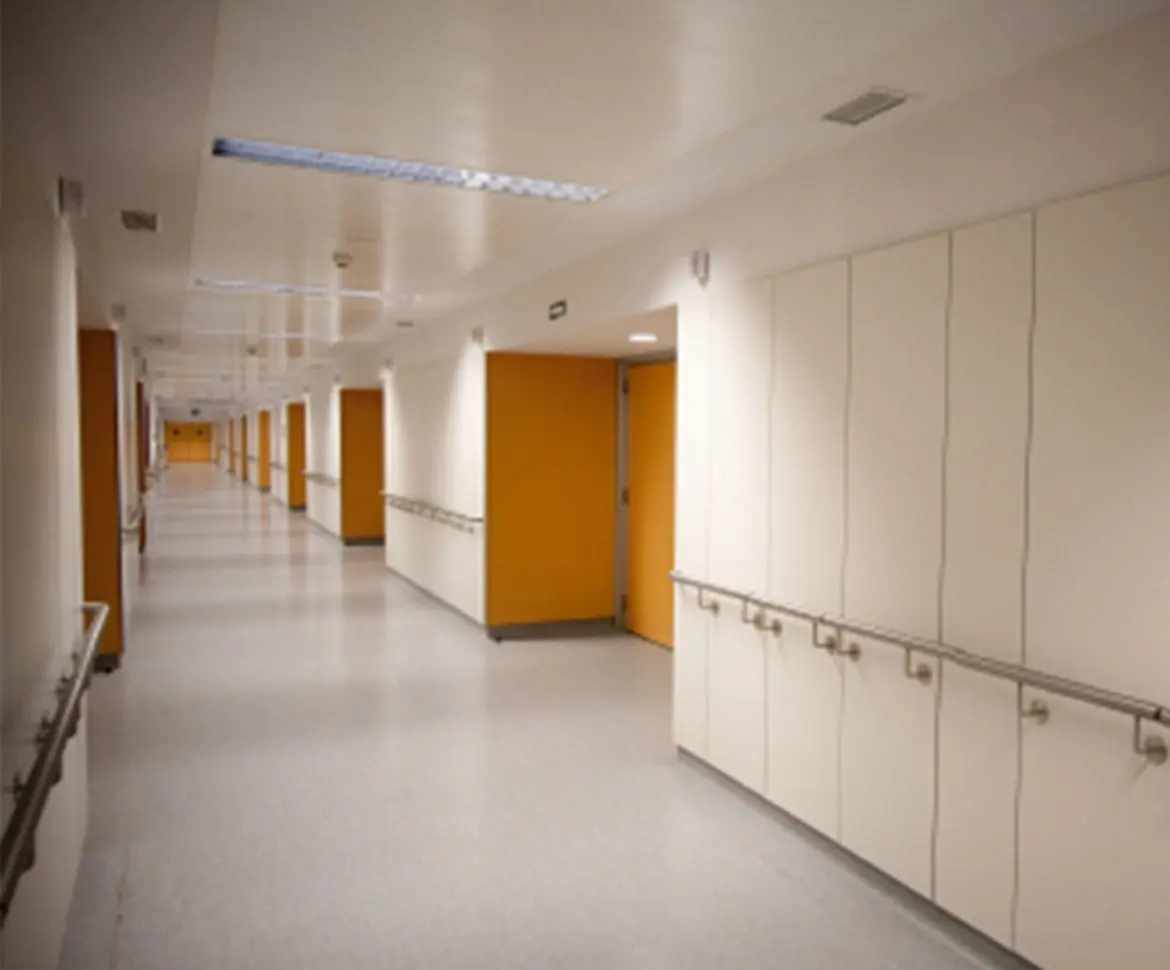 Pharmaceutical facility clean room with chemical-resistant floor coating