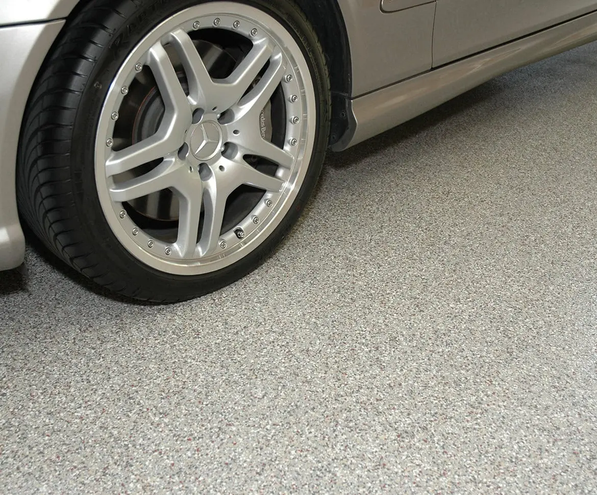 Polished epoxy parking deck with Hertz branding and yellow lane markings